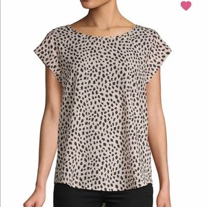 Cap-sleeve top with allover print. • Roundneck